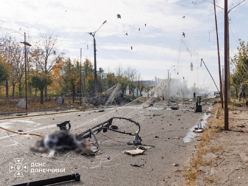 The road next to the bus after the strike — graphic aftermath, blurred