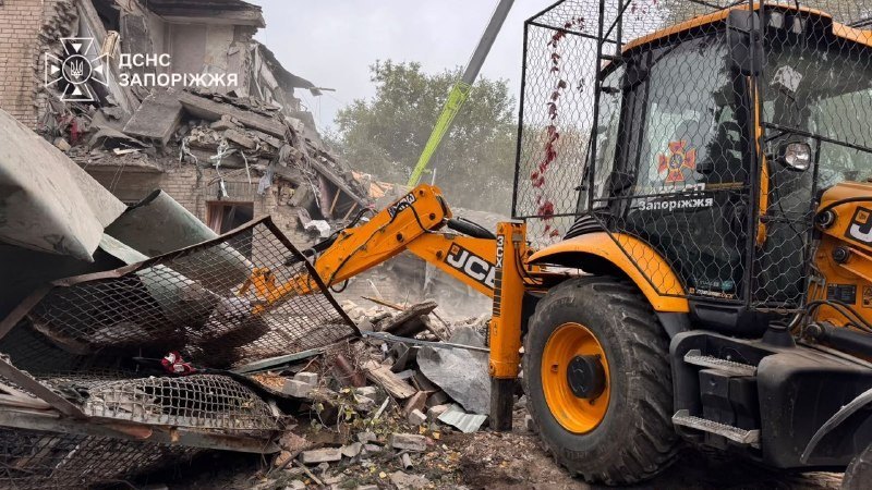 An excavator clears the collapsed section