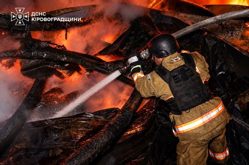 Firefighters at a night fire after the drone attack, 15 Oct