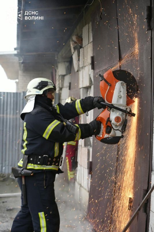 Lutsk, 16 Oct: firefighters at a burning garage cooperative after the Russian attack