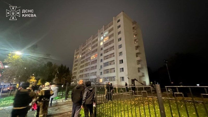 Kyiv, evening of 26 Oct: residents outside a high-rise near the impact site