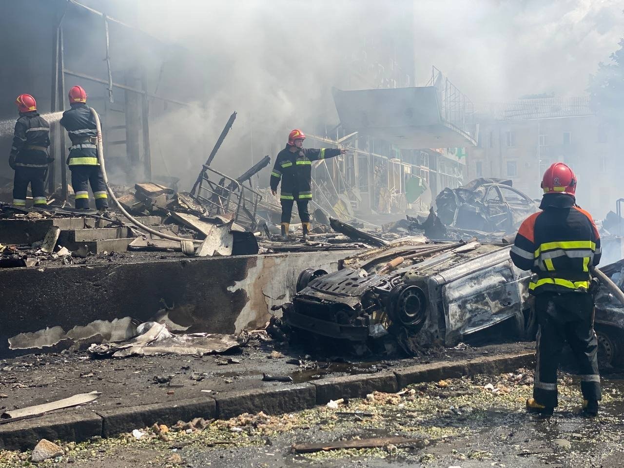 Burnt-out cars on the parking lot by the Officers' House