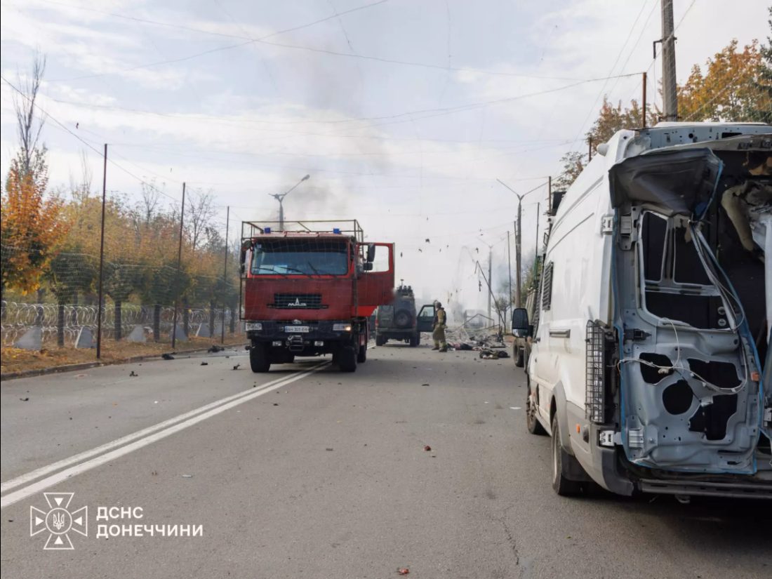 Kramatorsk: the strike site on the morning of 8 October; the burnt-out bus is behind the fire engine