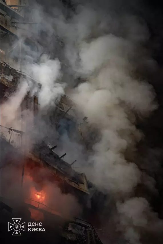 Kyiv, Desnianskyi district: the residential block burning after the strike (SES Kyiv, night of 9–10 October)